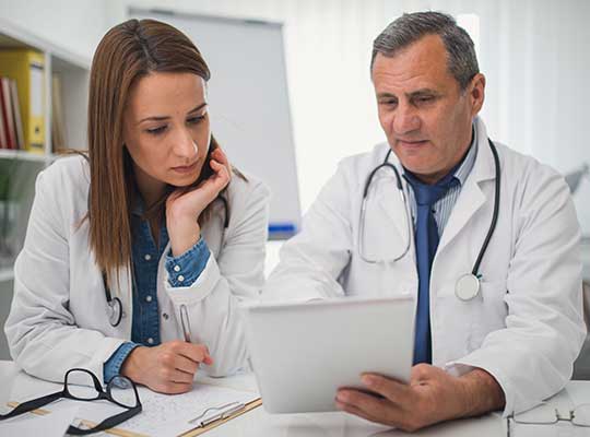 doctor looks at medical history with a dnp